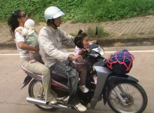 Family of Four on Motorbike in Thaialnd